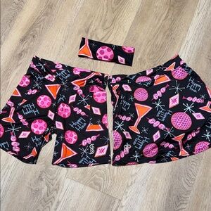 Bundle of 3 skort, biking shorts & headband by Bella.  “Happy hour” pattern